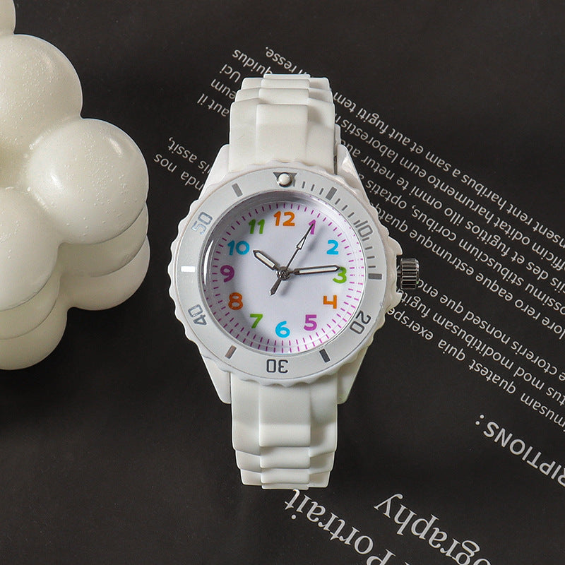 White kids analog wristwatch with silicone strap and colorful dial markers