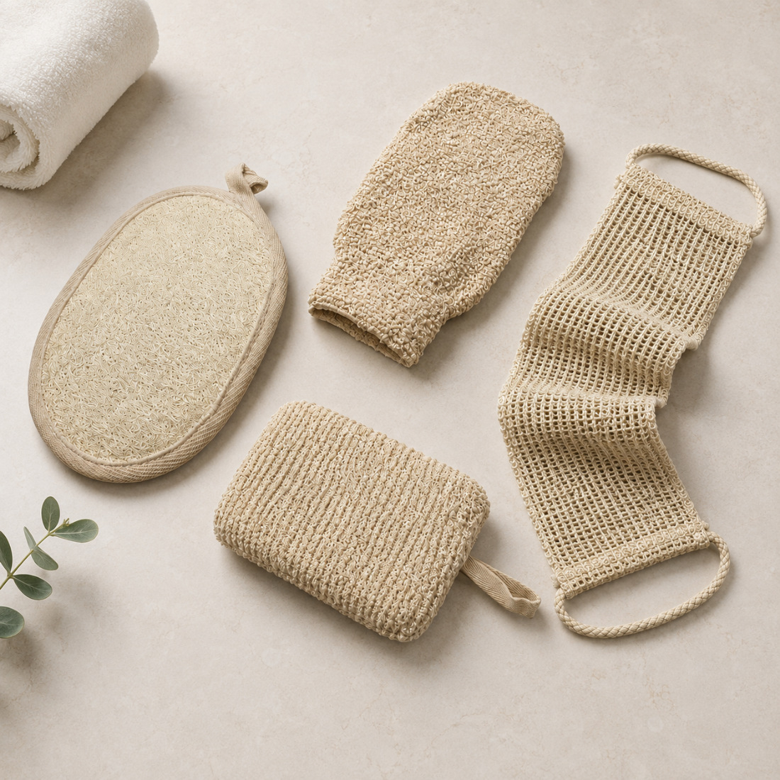 Exfoliating spa scrub set of five beige exfoliating tools: round, oval, mitt, and two mesh scrubbers