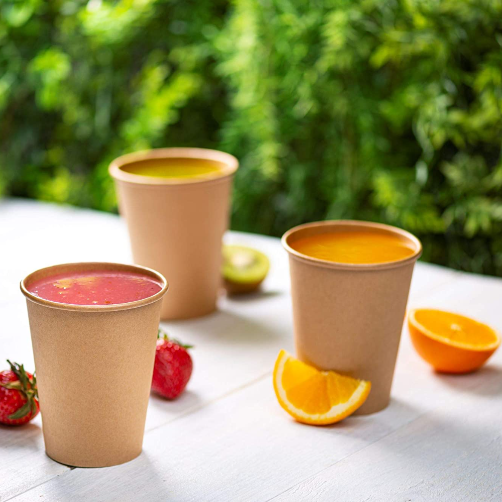 Kraft hot coffee cups with colorful drink fills outdoors