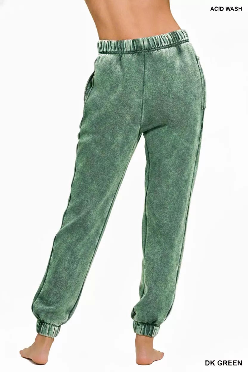 Dark green acid-wash fleece sweatpants with elastic waistband, drawstring, side pockets