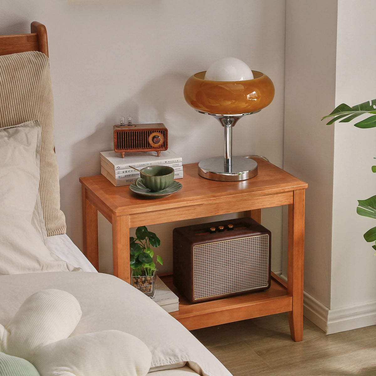 Wooden bedside table with open lower shelf and warm brown finish