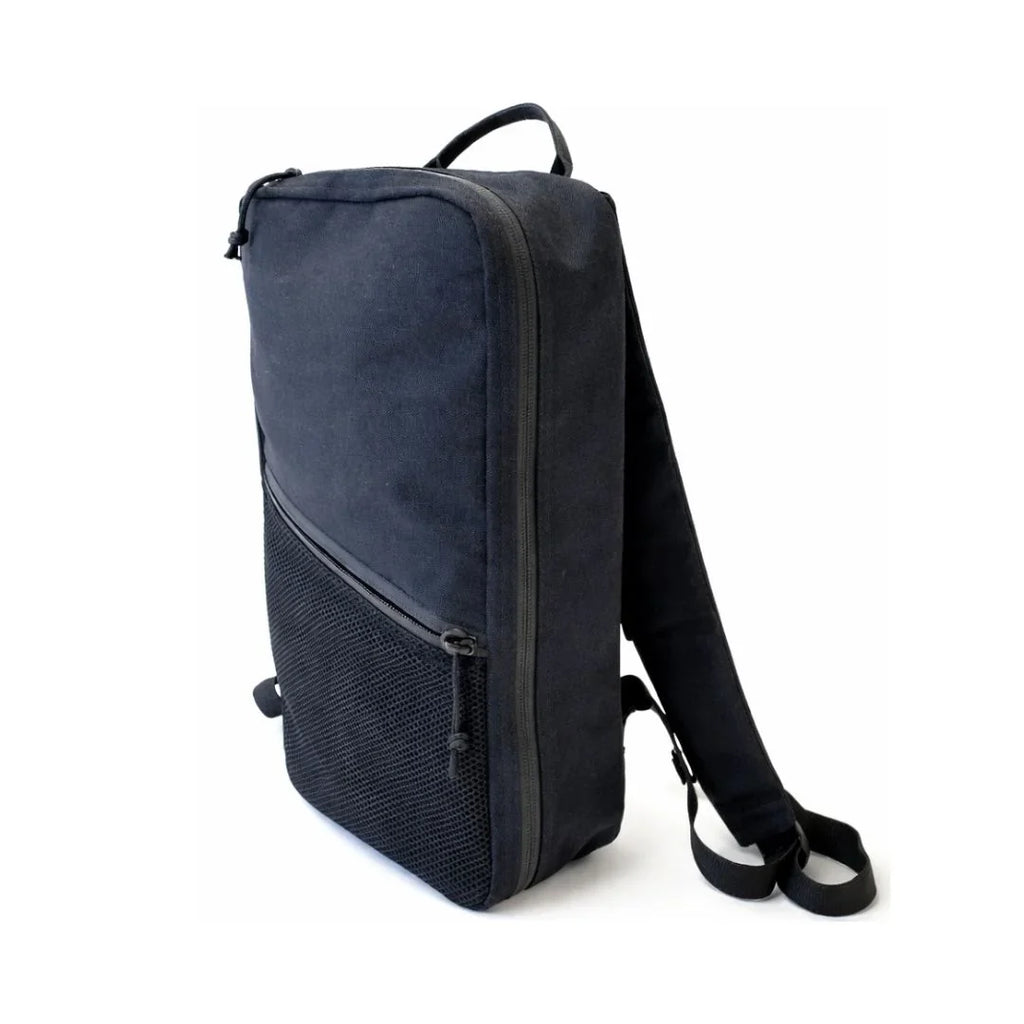 Dark backpack with front zipper, two-tone fabric, and adjustable shoulder strap