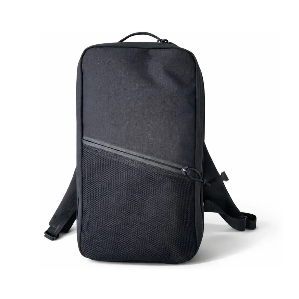 Minimalist dark backpack with top handle, zip front pocket, and adjustable shoulder straps