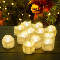 Set of 12 LED timer candles, white wax votive style with glowing flame tips