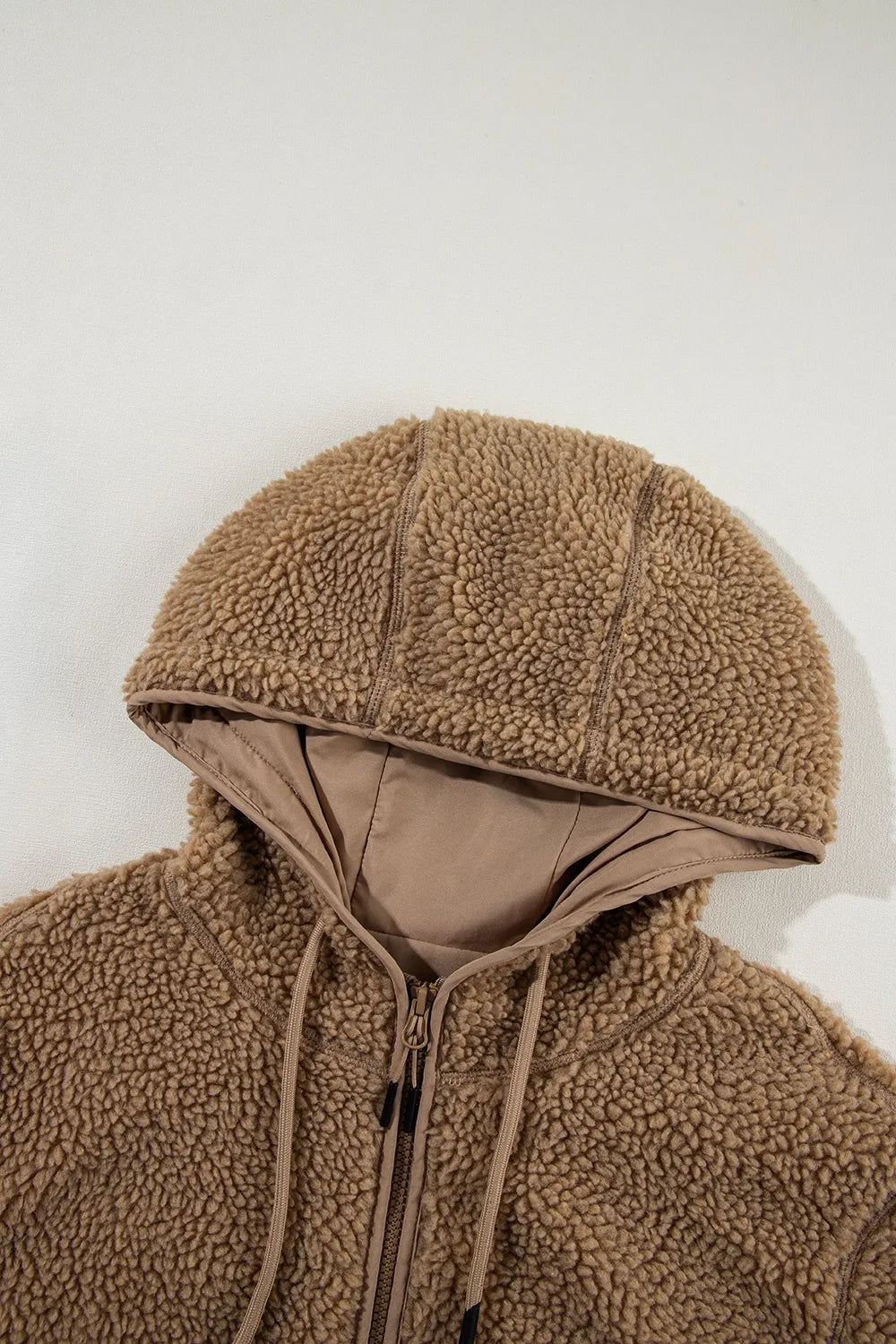 Khaki sherpa fleece hood with adjustable drawstring and inner lining