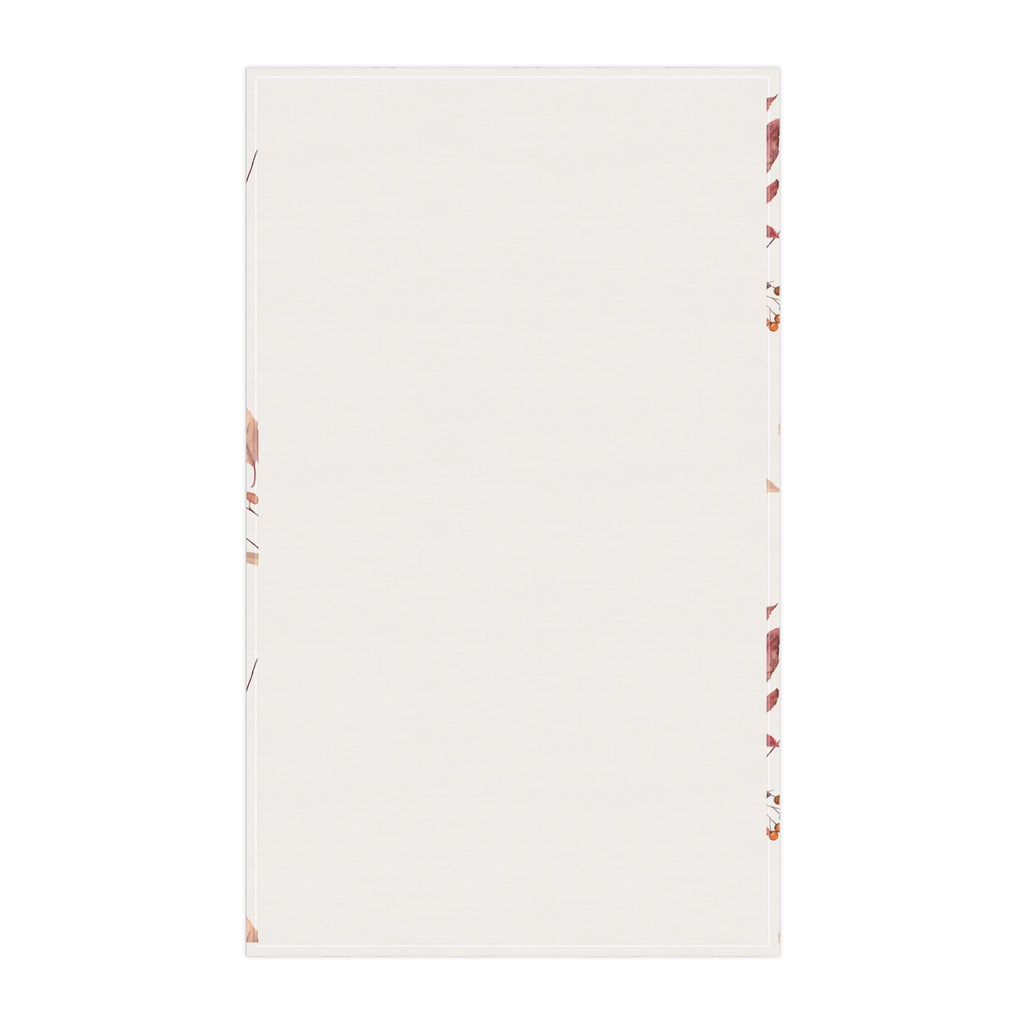 Plain white tea towel with small fall print border along edges