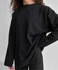 Black long-sleeve loose cotton T-shirt with crew neck and relaxed drape