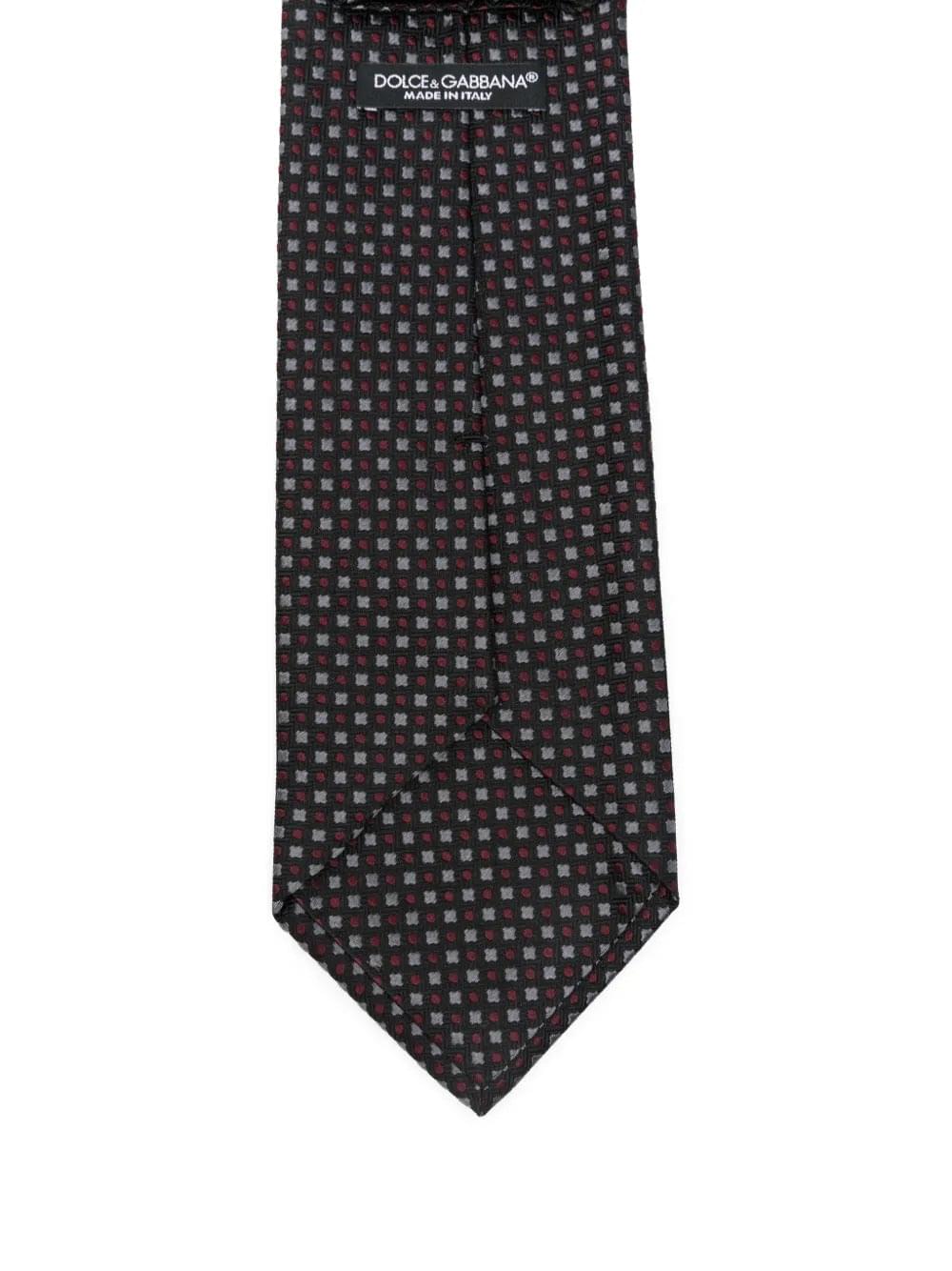 Dolce & Gabbana men’s silk tie, dark with red/white repeating geometric pattern