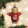Hanging bear ornament with red glitter sweater and “I LOVE YOU MORE” front text