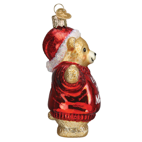 Side view hanging teddy bear ornament in red glitter coat with gold trim details