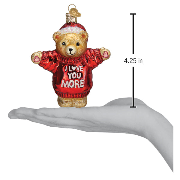 Teddy bear ornament on a hand, hanging loop top; size shown as 4.25 in