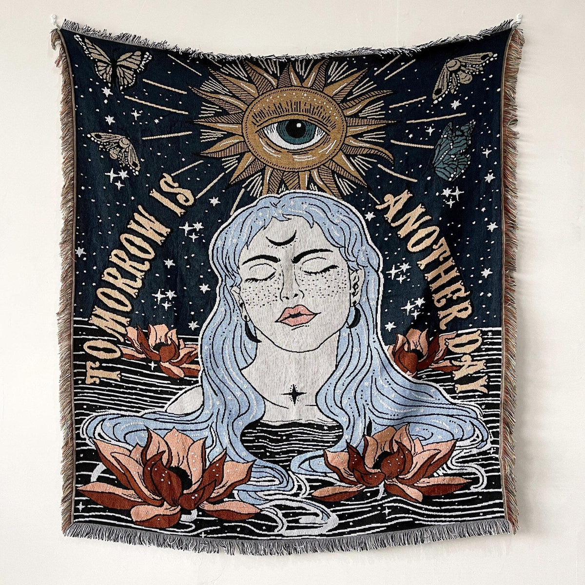 Dark navy towel blanket with central sun eye, woman portrait and flowers, fringed border