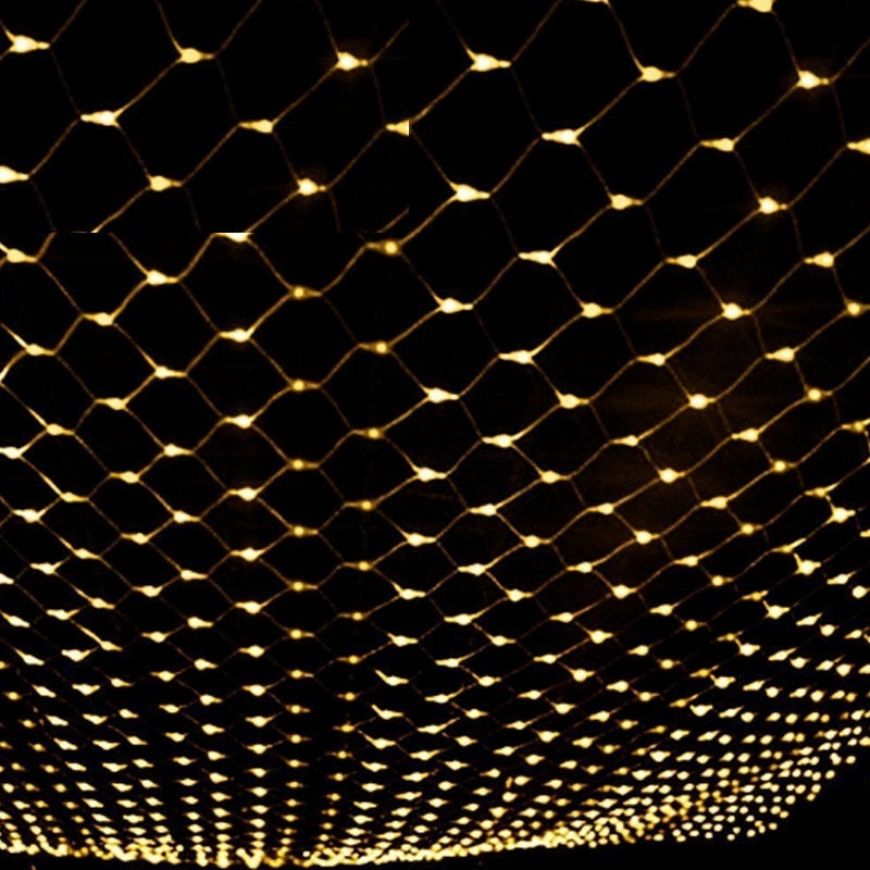 Warm white LED fishnet string lights forming a dense grid of glowing points