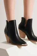 Black faux-leather ankle boots with pointed metal toe and block heel, pair front view