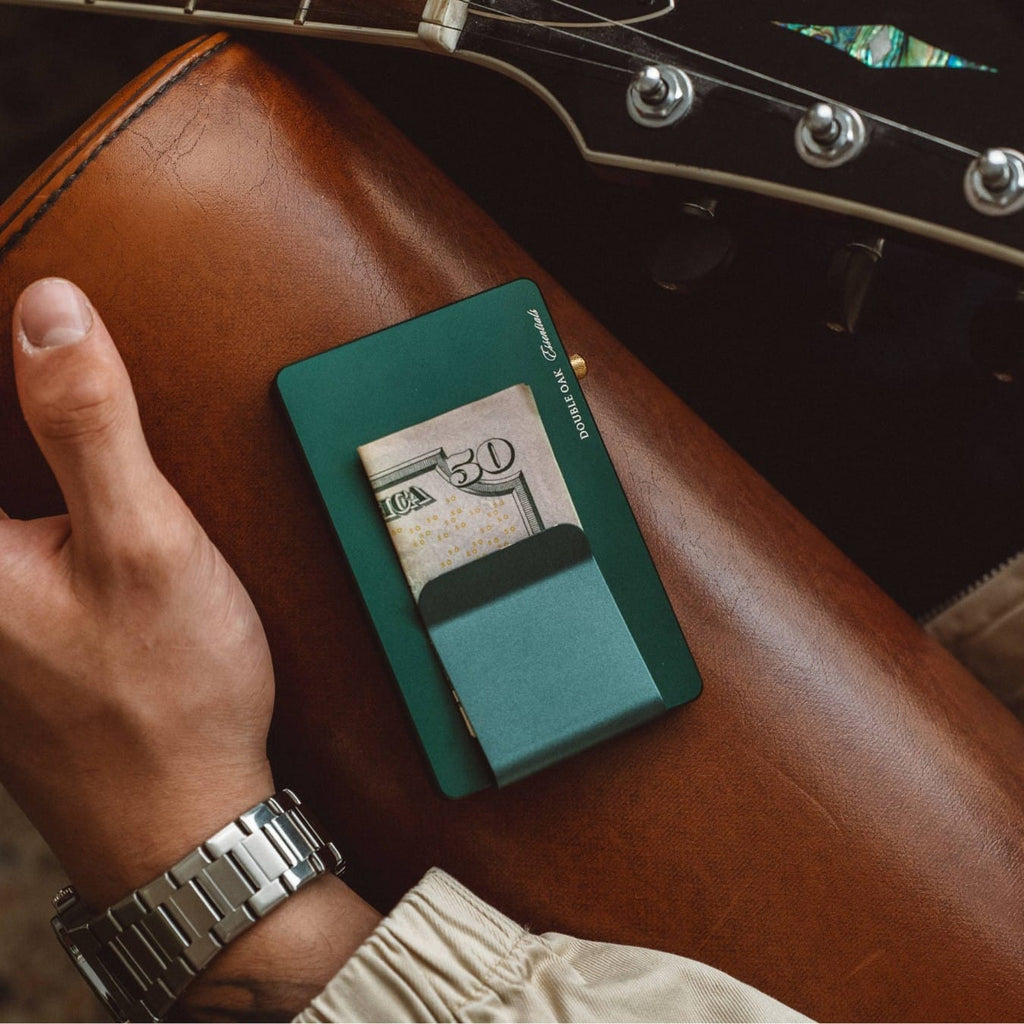 Teal pop-up cardholder showing a card extended from the front slot