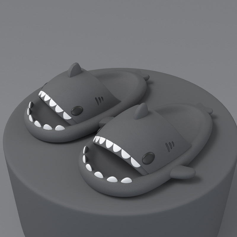 Grey shark-shaped slide sandals, open toe with molded fin and white tooth detail