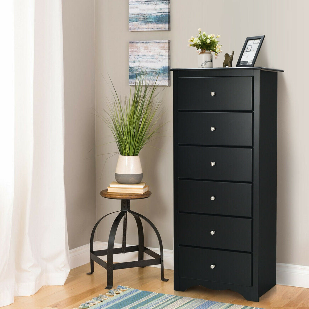 Black 6-drawer chest dresser with four front drawers and round metal knobs.
