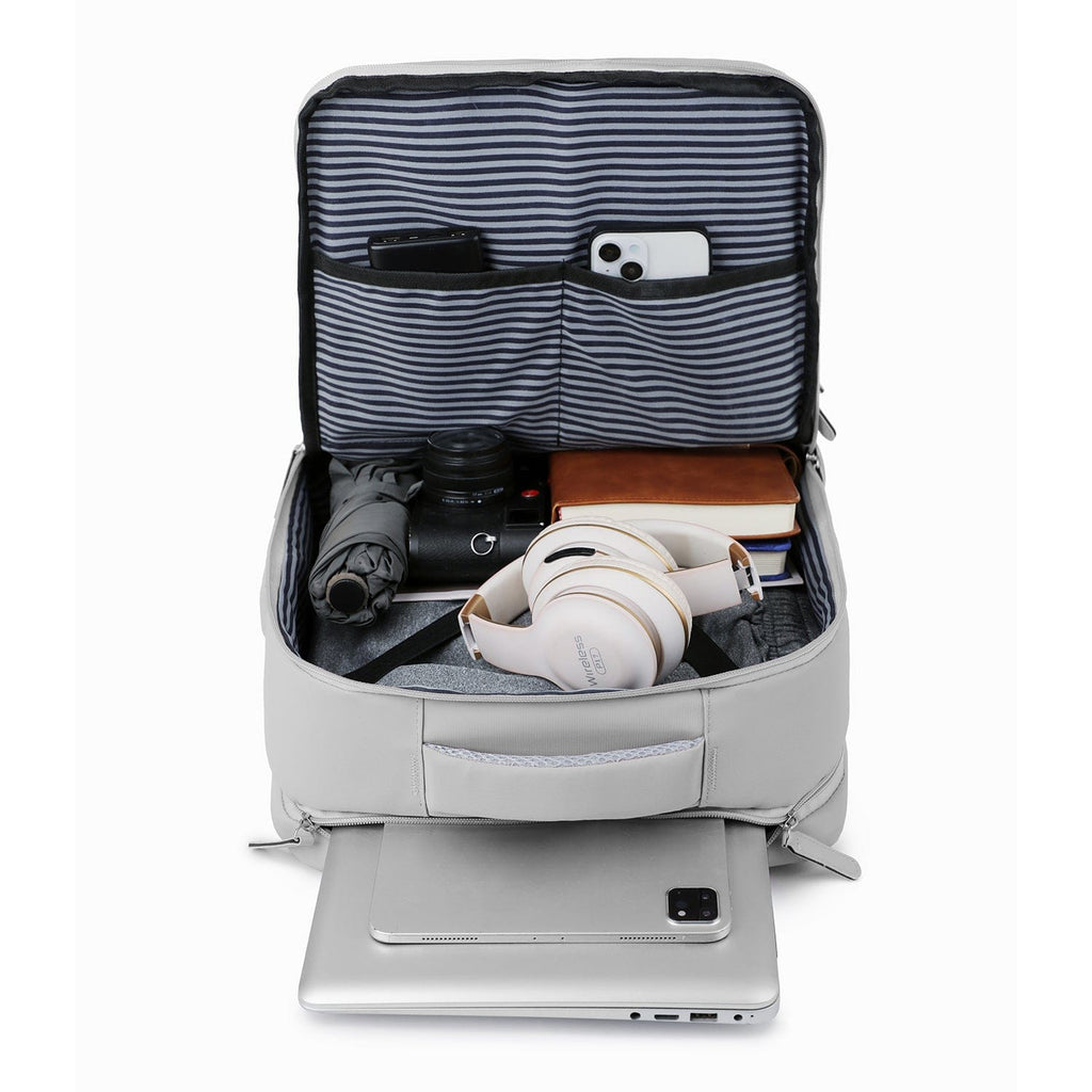 Storm gray open backpack showing striped interior pouches and laptop compartment