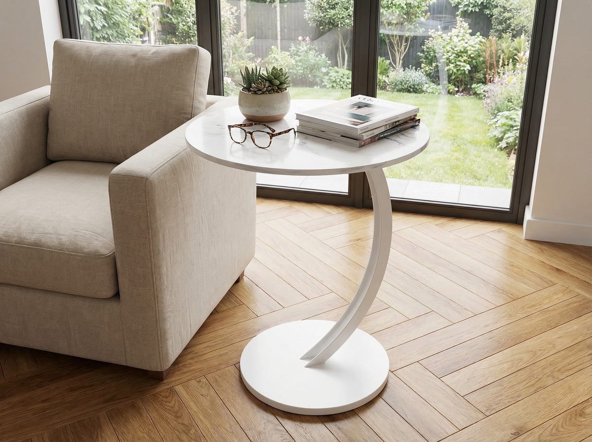 White round side table with curved pedestal base and single tabletop.