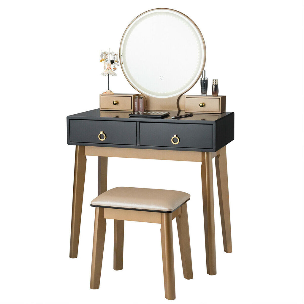 Makeup vanity table set with round illuminated mirror, black drawers, and beige upholstered stool