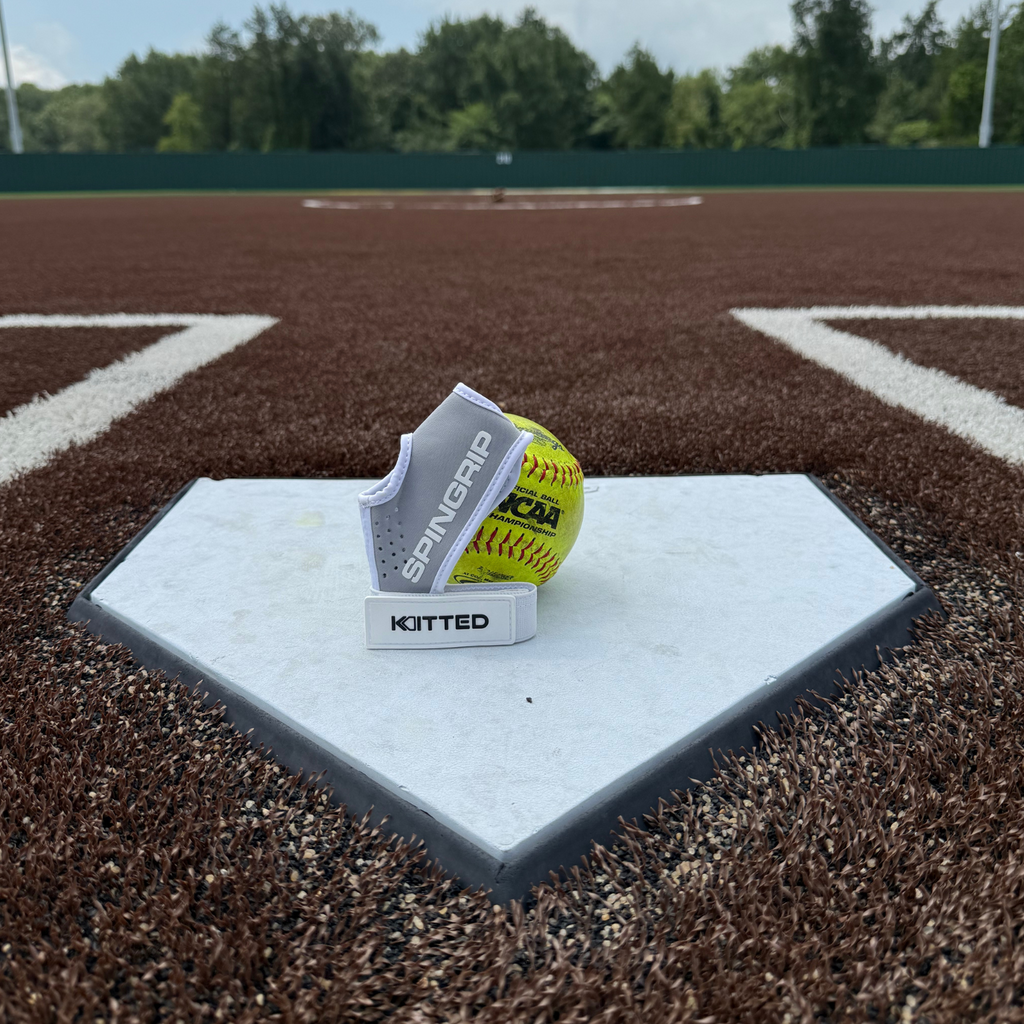 Softball training grip set: neon yellow ball on gray padded base strap
