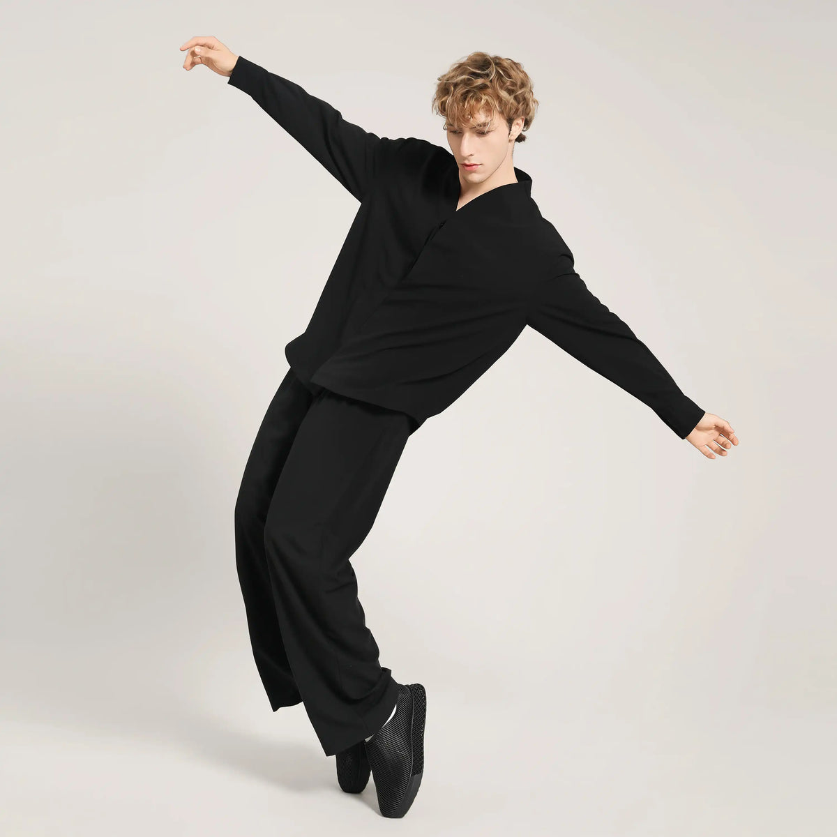 Black 3D printed slip-on sneakers on model in motion