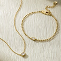 Gold oval-linked bracelet with small oval diamond centerpiece and toggle clasp