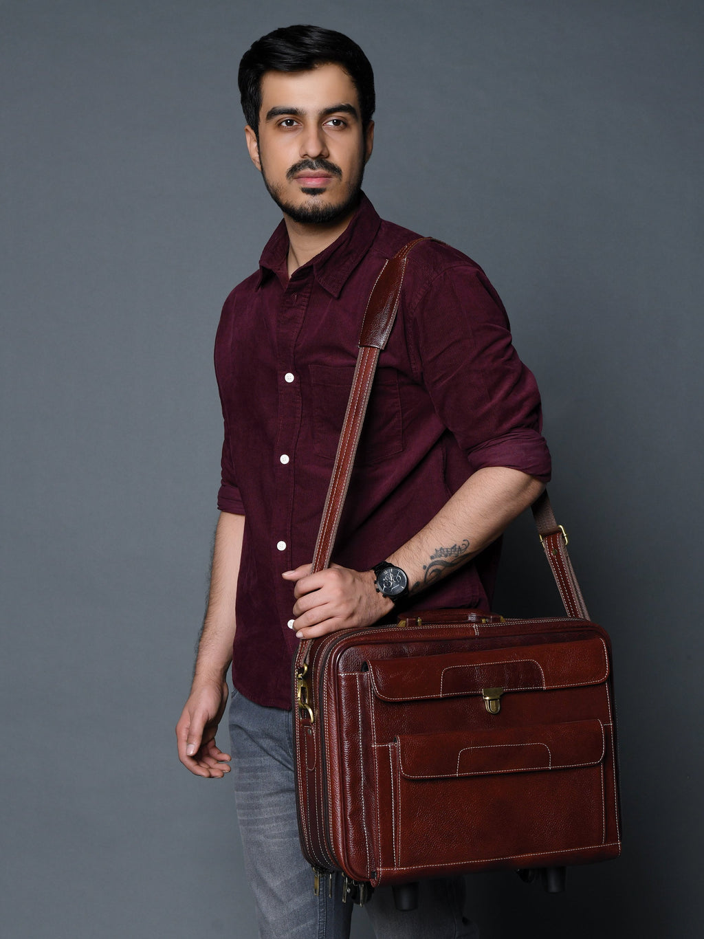 Dark brown leather trolley suitcase bag with dual handles and front pockets