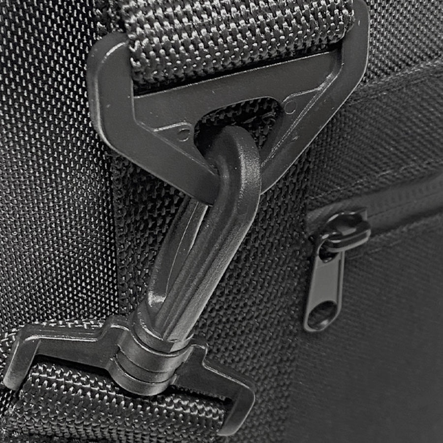 Black nylon cooler bag zipper pull and molded plastic latch detail