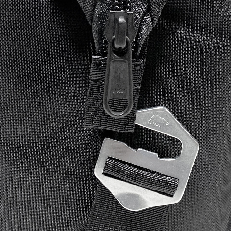Black nylon cooler bag zipper with metal D-ring and pull tab close-up