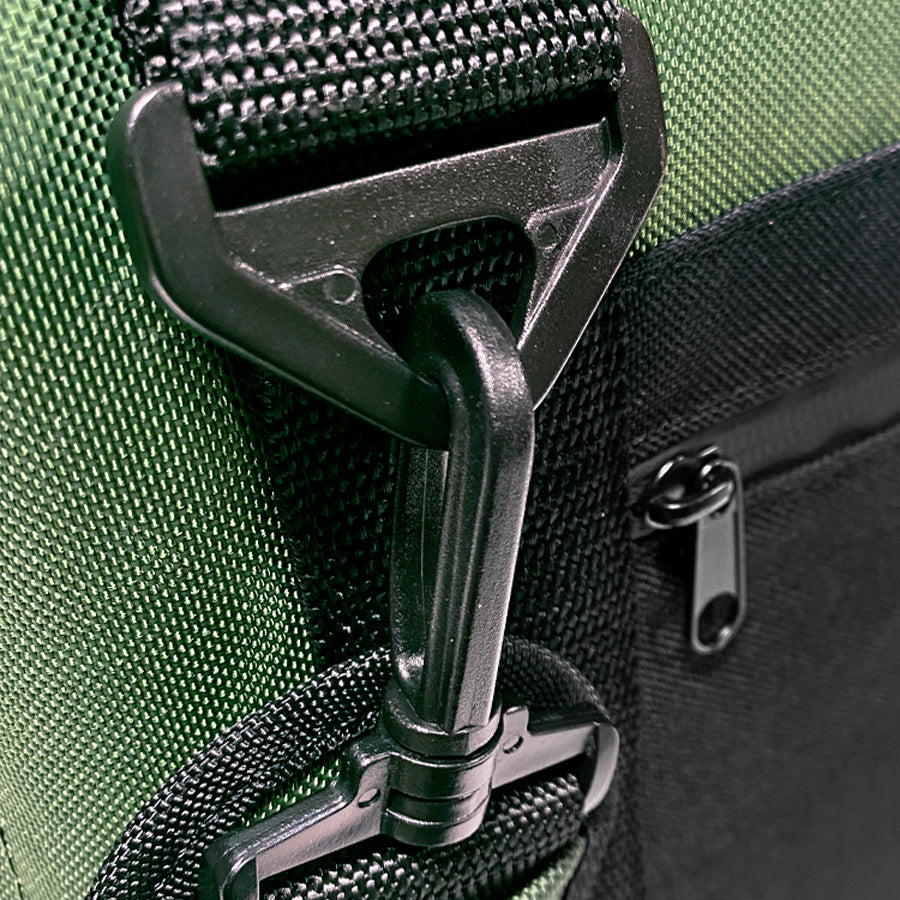 Close-up of strap connector and zipper pull on dark fabric cooler