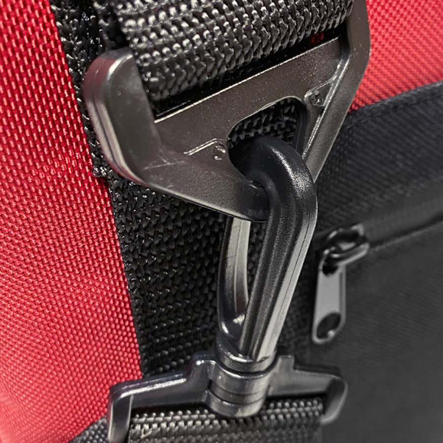 Close-up of red nylon cooler with black zipper pull and metal zipper slider