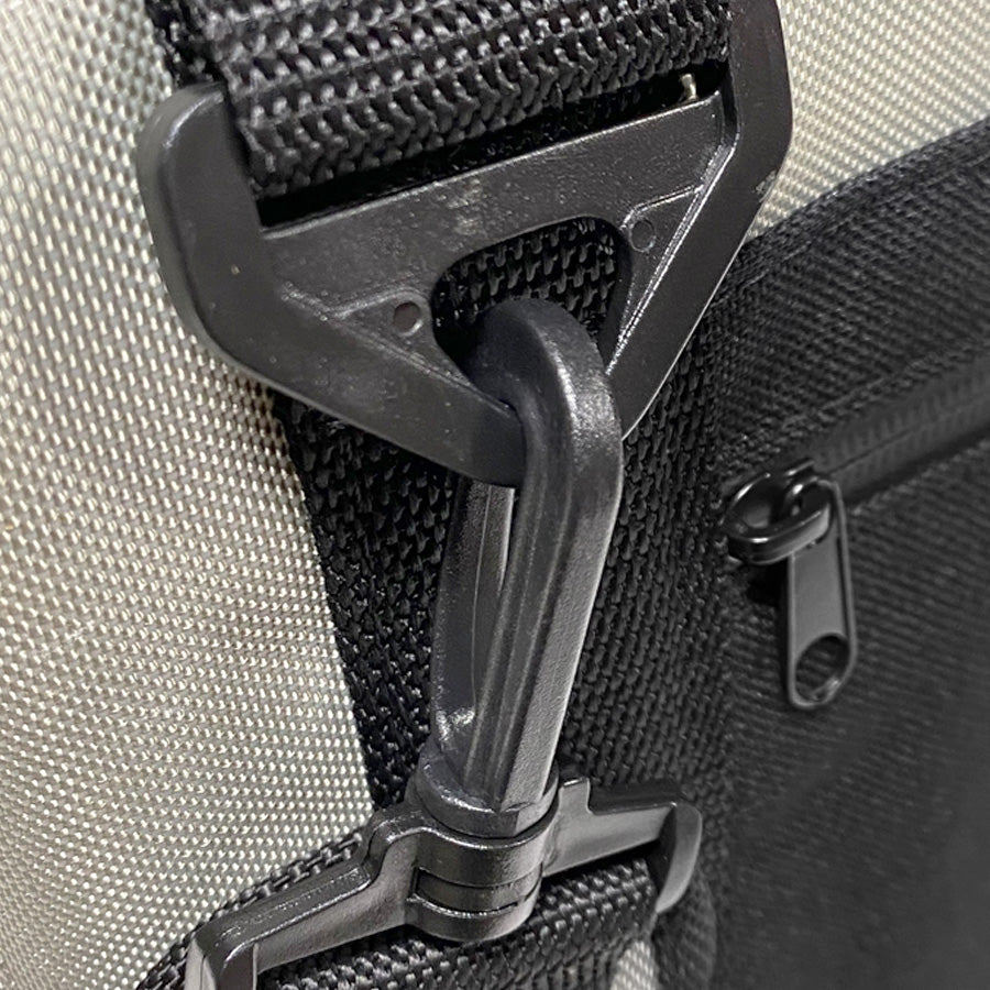 Nylon cooler bag close-up of strap buckle and zip pull with metal hardware