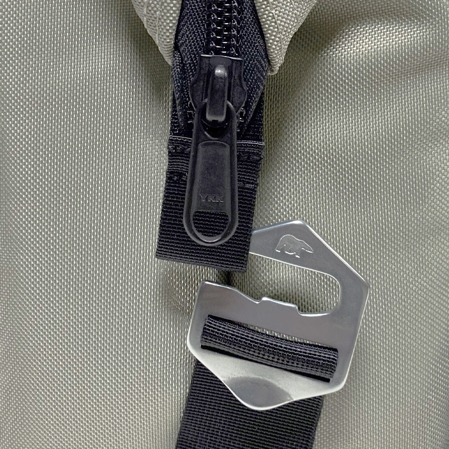 Cooler bag close-up of zipper pull and adjustable webbing strap attachment