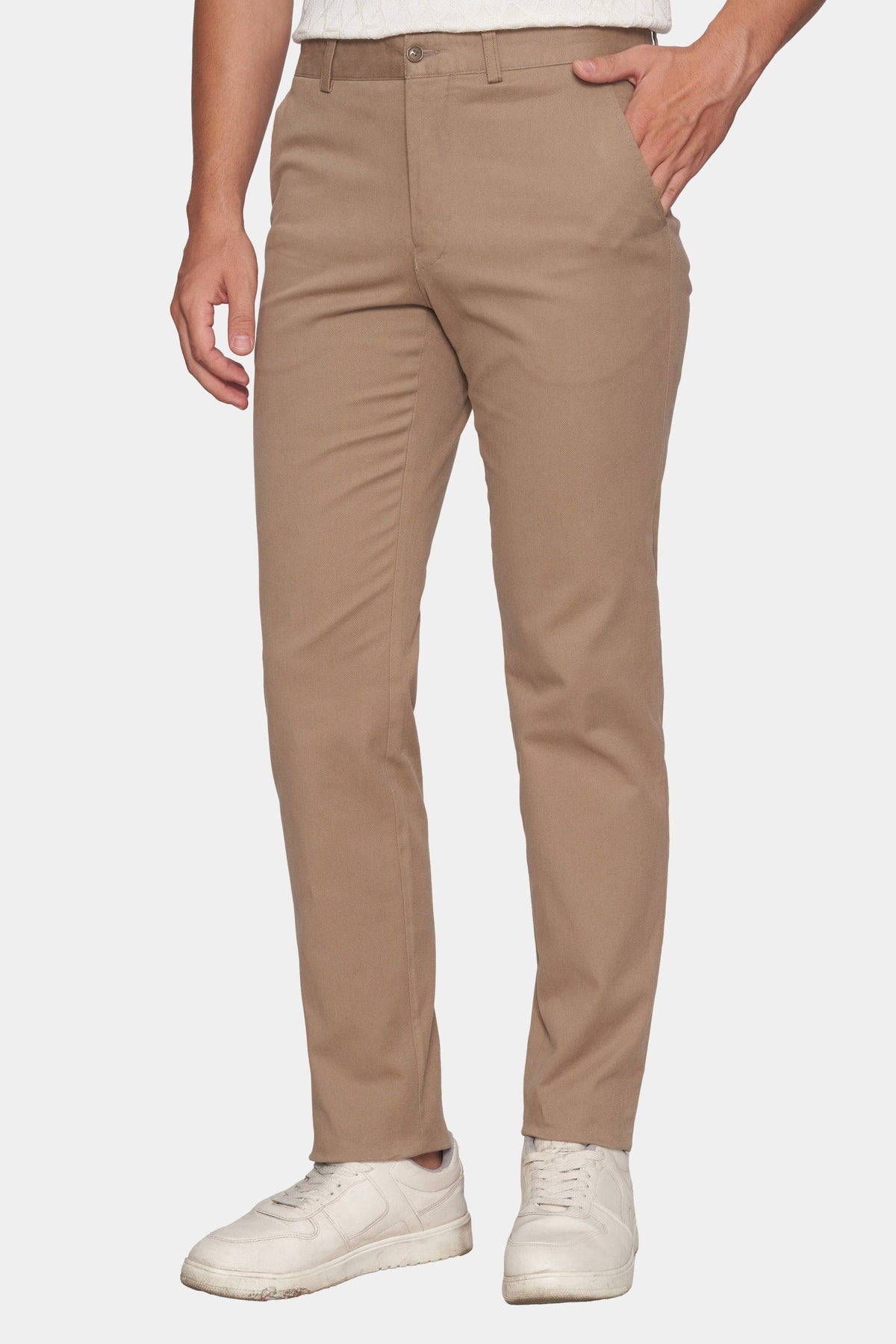 Tan chino pants with zip fly, belt loops, and front slant pockets