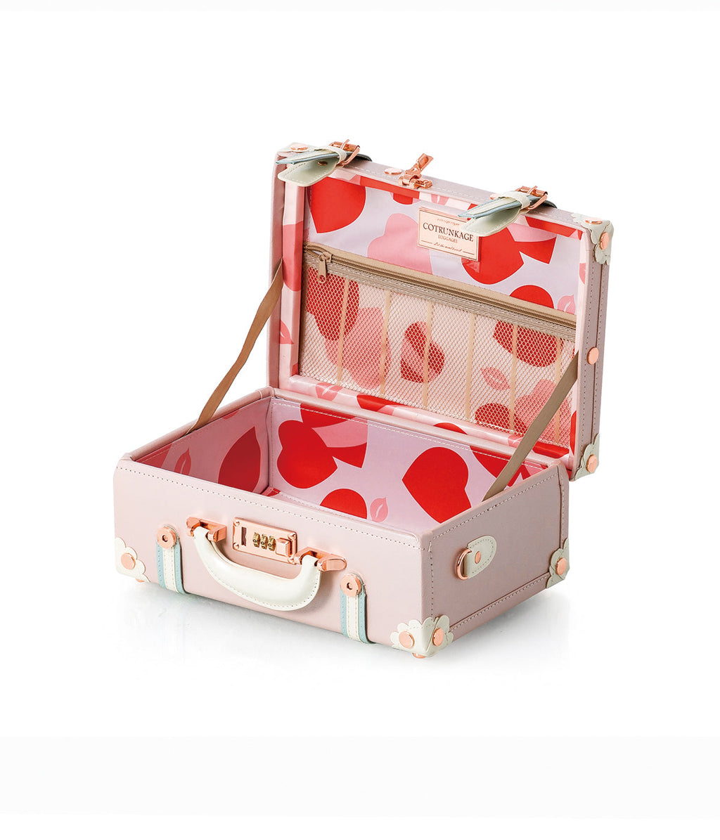 Open Cherry pink train case with heart-pattern organizer and elastic straps