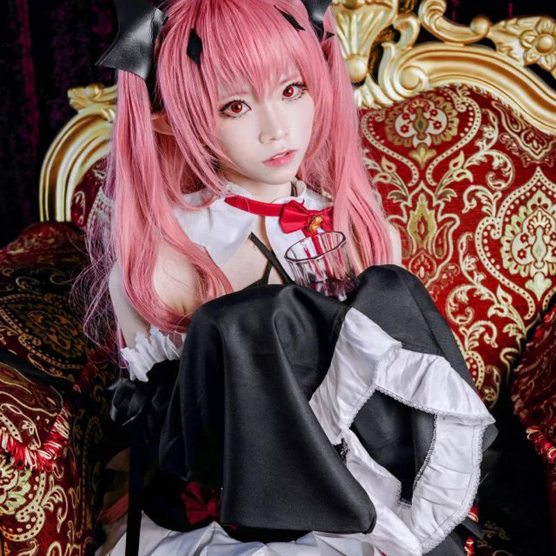 Black dress with white underlayer and red ribbon bow, horned headpiece, seated pose