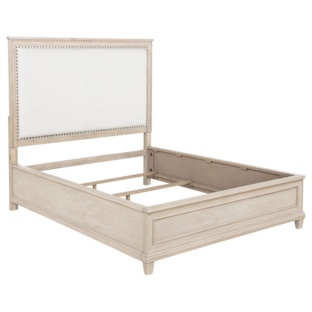 Queen bed frame with panel headboard and open platform base in washed oak