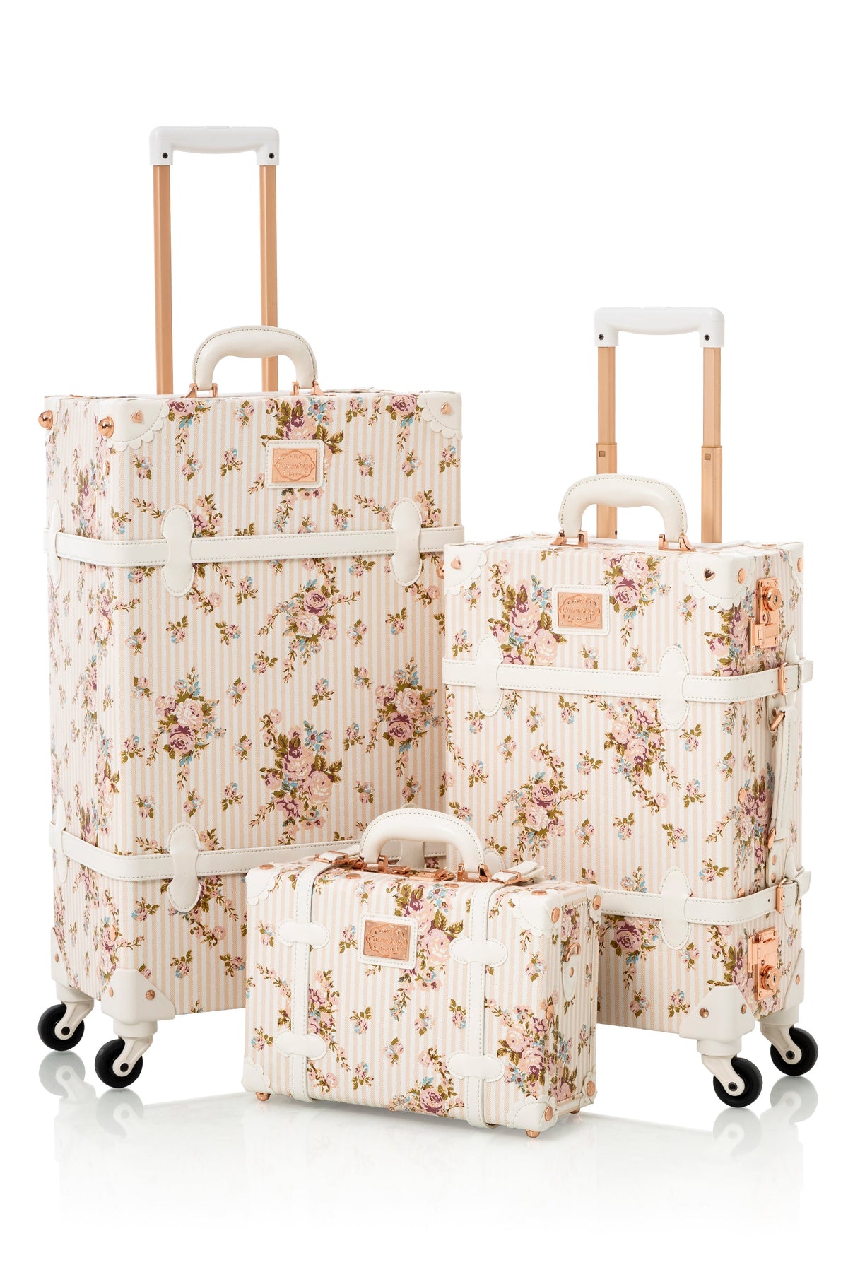Beige floral 3-piece rolling luggage set with telescoping handles and wheels