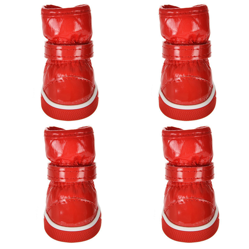 Red pet ski boots shown from multiple angles, with white-trim rubber soles and hook straps