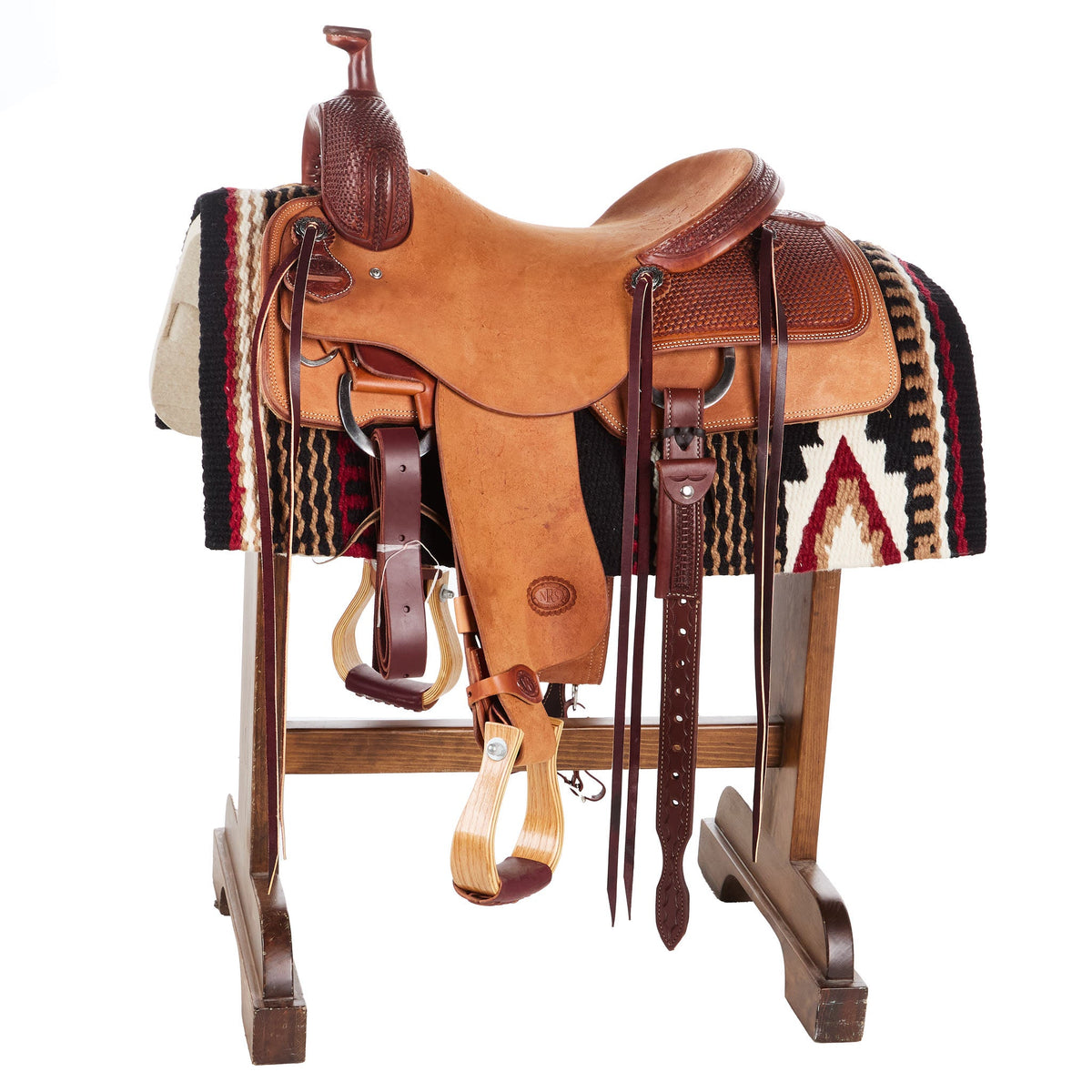 Wool saddle blanket on a saddle with dark stripes and tan star accents