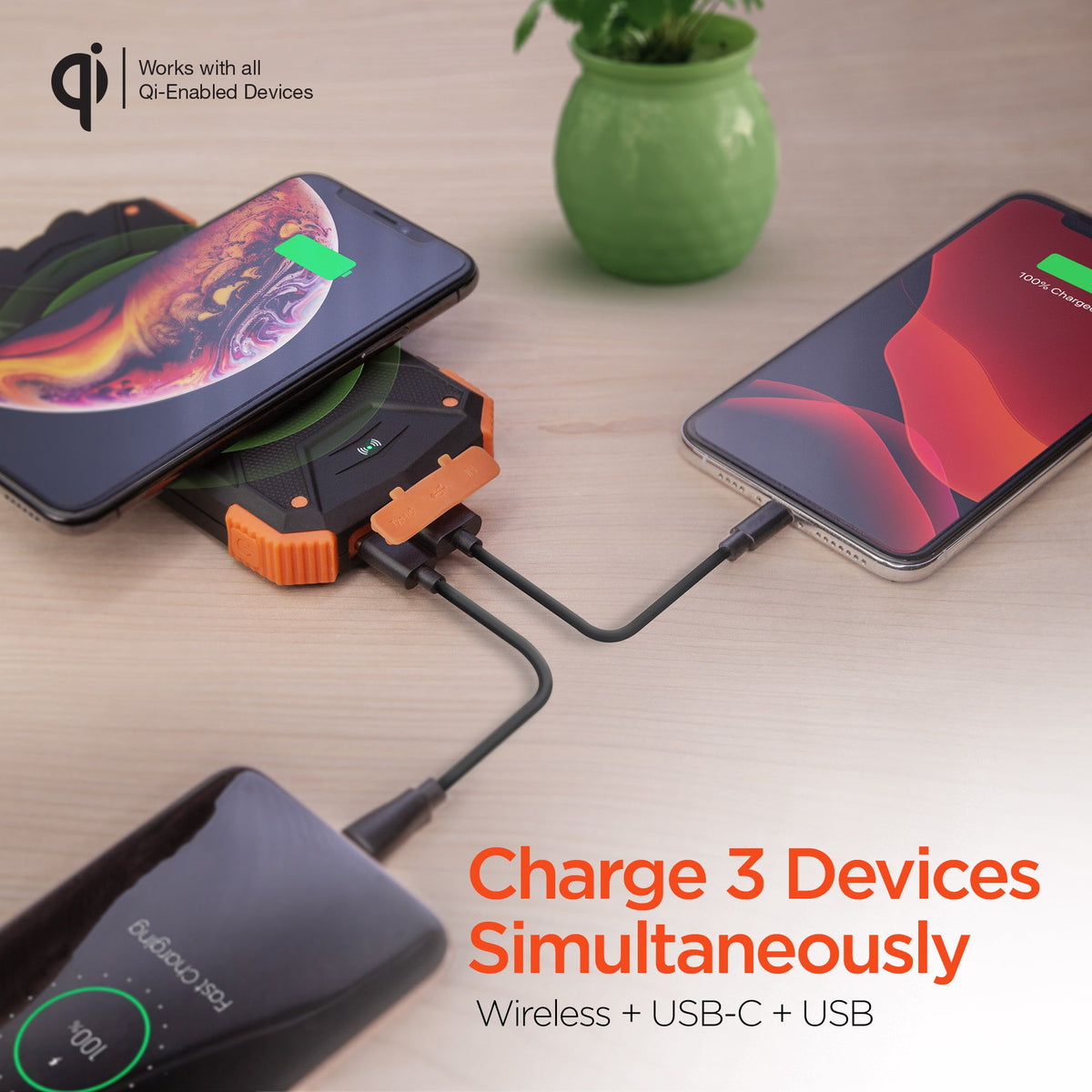 Wireless power bank with solar panel charging two smartphones simultaneously