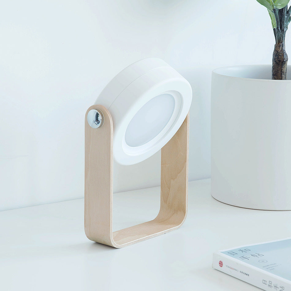 Foldable LED lantern with ribbed translucent shade and light wood frame