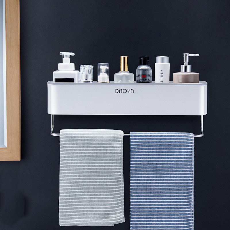 Wall-mounted bathroom shelf with two tiers, white shelves and two striped towels