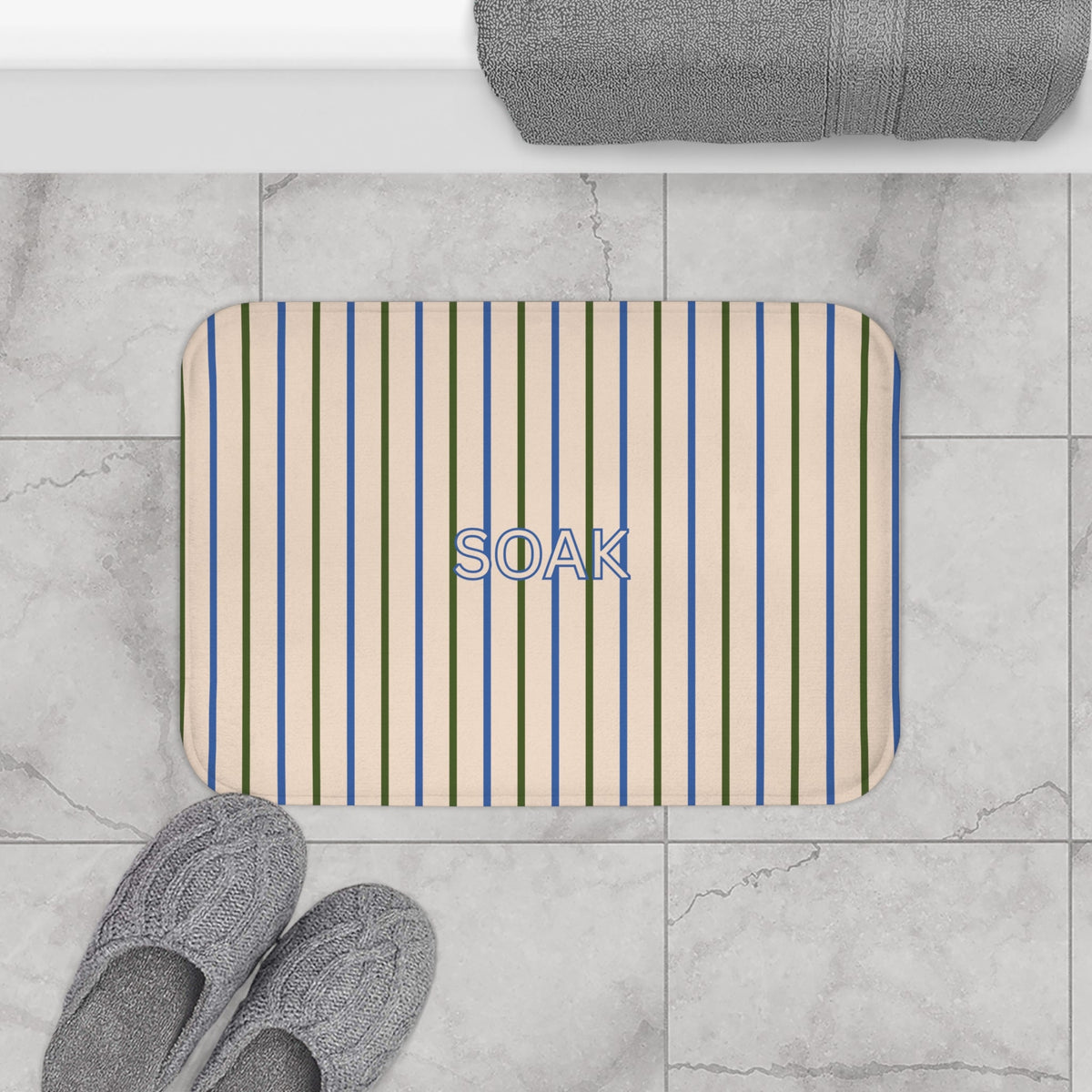 Striped bath mat with blue, green, and beige vertical lines and rounded corners