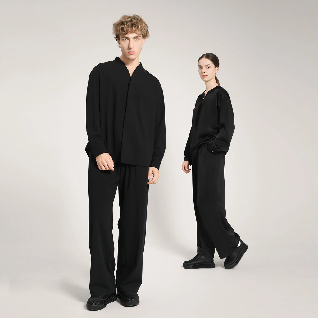 Black 3D printed slip-on sneakers on two models, standing