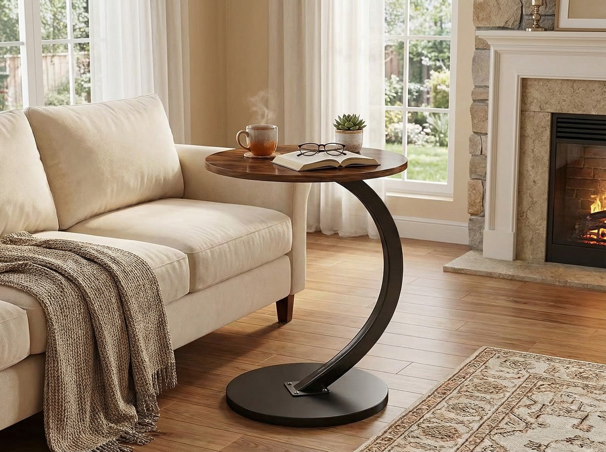 Wood round side table with curved black base and lower shelf.