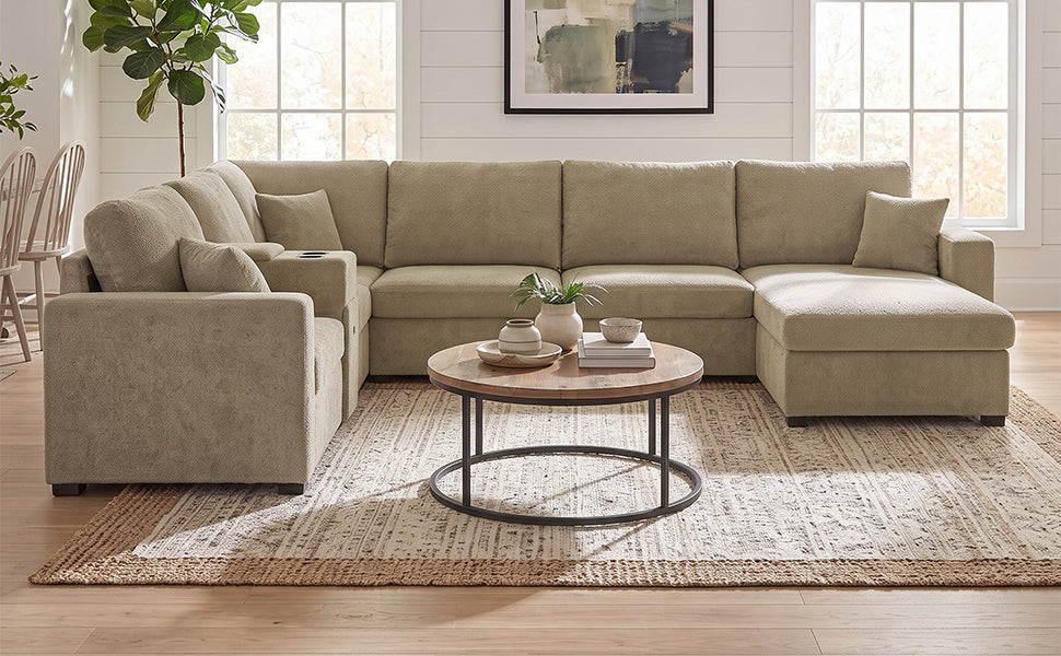 Beige modular sectional sofa viewed from the front with chaise and supportive arms