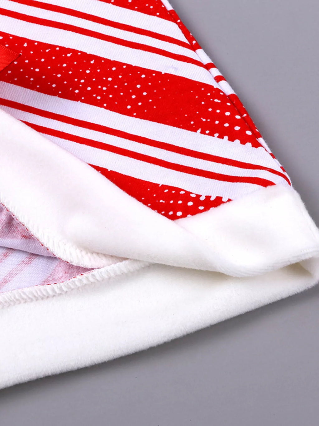 Folded red-and-white striped top with soft white knit cuff and hem