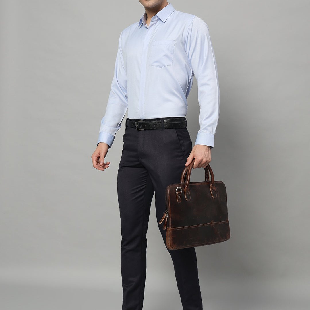 Dark brown leather laptop bag with front zipper pocket and shoulder strap